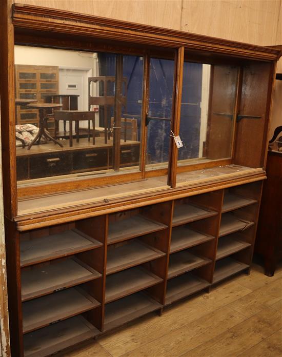 A late Victorian mahogany shop cabinet W.214cm